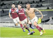  ?? REUTERS ?? West Ham’s Manuel Lanzini, right, celebrates scoring against Tottenham.