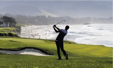  ?? Michael Macor / The Chronicle ?? Dustin Johnson, swinging on No. 8 at Pebble Beach, made the cut in his second tourney back from a leave.