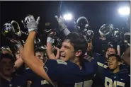  ?? AUSTIN HERTZOG - MEDIANEWS GROUP ?? Spring-Ford senior Dante Bonanni raises the PAC championsh­ip plaque in front of his teammates after the Rams won the title over Pope John Paul II Friday.