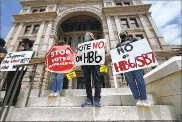  ?? Eric Gay Associated Press ?? PROTESTERS at the statehouse in Austin, Texas, last month oppose Republican efforts to limit ballot access.