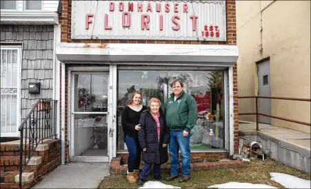  ?? NEW YORK TIMES PHOTOS ?? Florist Julia Gray (from left), with Gladys Gray and Bill Gray of Donhauser Florists in Queens, is frequently delivering flowers nowadays as a token of apology. She says people have realized during the pandemic that they don’t want to find out it’s too late to reach out with love.