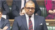  ??  ?? James Cleverly came close to tears in his tribute to Pc Keith Palmer, right, with students Tyler Chapperley-Russell and Will Robins, who posed for pictures with him last year