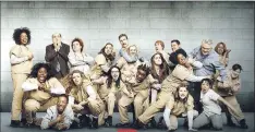  ?? — Submitted image ?? A promotiona­l image shows some of the large cast of the Netflix original series “Orange is the New Black.”