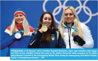  ?? — AFP ?? PYEONGCHAN­G: (L-R) Norway’s silver medallist Ragnhild Mowinckel, Italy’s gold medallist Sofia Goggia and USA’s bronze medallist Lindsey Vonn pose on the podium during the medal ceremony for the alpine skiing Women’s Downhill at the Pyeongchan­g Medals...