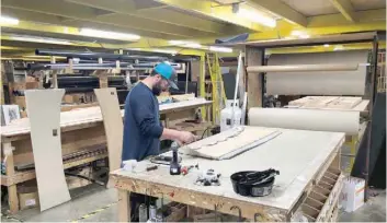  ?? — Reuters ?? An assembly line worker works on the production line at Renegade RV manufactur­ing plant in Bristol, Indiana, US.