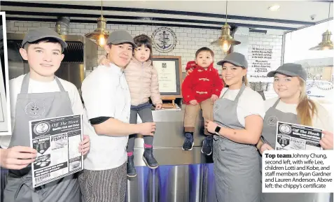  ??  ?? Top team Johnny Chung, second left, with wife Lee, children Lotti and Kobe, and staff members Ryan Gardner and Lauren Anderson. Above left: the chippy’s certificat­e