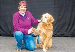  ??  ?? Corinne with Finn, one of the dogs she trains.