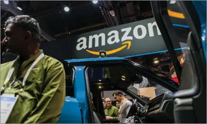  ?? ALEX WELSH — THE NEW YORK TIMES ?? A Rivian truck at the Consumer Electronic­s Show in Las Vegas is seen Jan. 8, 2019. Rivian and Amazon said Thursday that hundreds of custom-made delivery vans are finally on the road.