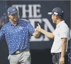  ??  ?? Dechambeau fist bumps Ryosuke Kinoshita in a practice round