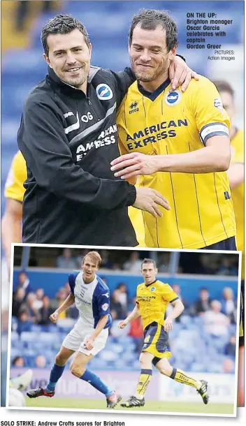  ?? PICTURES: Action Images ?? SOLO STRIKE: Andrew Crofts scores for Brighton ON THE UP: Brighton manager Oscar Garcia celebrates with captain Gordon Greer