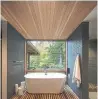  ??  ?? The Japanese-style ofuro tub provides a nature-infused element of serenity. Right, the retreat’s design and materials blend with its surroundin­g natural environmen­t.