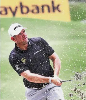  ??  ?? It has been a while: Lee Westwood playing a shot in the Pro-Am event yesterday. — FAIHAN GHANI/ The Star