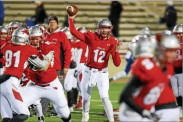  ?? TIM PHILLIS — THE NEWS-HERALD ?? Mentor’s Tadas Tatarunas warms up before the Cardinals’ 27-21 victory over Olentangy Liberty in a Division I state semifinal on Nov. 24 in Mansfield.