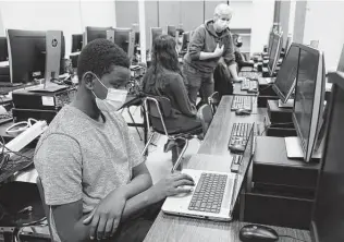  ?? Jerry Lara / Staff file photo ?? NISD students work on lessons late last year. The district has a plan to keep students safe and learning, but Texas is dragging its feet on delivering federal relief intended for that purpose.