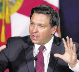  ?? JOE BURBANK Orlando Sentinel/TNS ?? Gov. Ron DeSantis, seen here during a discussion with theme park leaders in 2020.