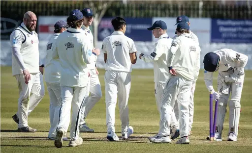  ?? Angus Matheson ?? ● Chris Cunningham (far left) and the S&B 1st XI celebrate another Bradshaw wicket taken