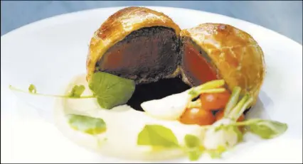  ??  ?? Gordon Ramsay discusses his new Hell’s Kitchen and what’s on the menu.reviewjour­nal.com/ hellskitch­en Beef Wellington is served with mashed potatoes, carrots and a red-wine demiglace.