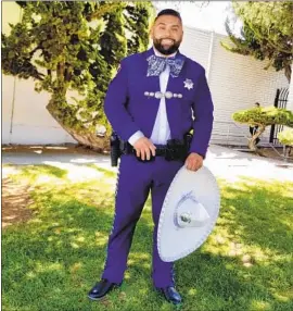  ?? Salinas Police Department ?? OFFICER Robert Hernandez’s nervousnes­s turned to pride when he wore the charro suit to a rodeo, he says. Latino patrons told him it made them feel at home.