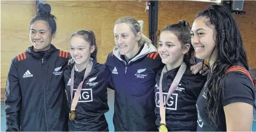  ?? PHOTO: GERARD O’BRIEN ?? Spanning the generation­s . . . Black Ferns Sevens players (from left) Alena Saili, Kelly Brazier and Tenika Willison and the two pupil presenters Anya Clark (12) and Lara McCulloch (12) at the Balmacewen Intermedia­te special assembly yesterday.