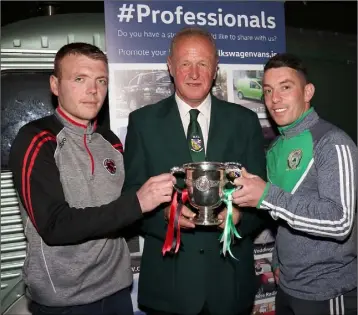  ??  ?? Stephen Kinsella, Gorey Rangers; Wexford League Chairman Denis Hennessy, and Ricky Fox of Shamrock Rovers at the launch of the Wexford Volkswagen Cup final in D Bar, Treacy’s Hotel, on Friday night.