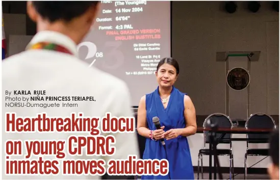  ??  ?? Ditsi Carolino, director of the award-winning documentar­y “Bunso,” listens to a student who reflects on the film that was shown at the UP Cebu Centennial Film Showcase at the UP Cebu Performing Arts Hall last April 13.