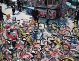  ??  ?? Shared bicycles are seen on a street in Beijing.