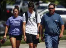  ?? KELLY WILKINSON/THE INDIANAPOL­IS STAR VIA AP ?? Scene near Noblesvill­e High School on Friday, after a shooting at Noblesvill­e West Middle School in Noblesvill­e, Ind. A male student opened fire at the suburban Indianapol­is school wounding another student and a teacher before being taken into custody,...