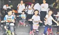  ??  ?? The kids on their bicyle all gearing up for the parade.