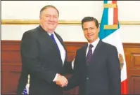  ?? The Associated Press ?? SEA CHANGE: In this photo released by Mexico’s Presidenti­al Press Office, Secretary of State Mike Pompeo and Mexico’s President Enrique Pena Nieto, shake hands on Friday at Los Pinos presidenti­al residence in Mexico City. Pompeo is leading a...