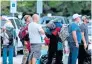  ?? AFP ?? SAFE SHELTER: People line up to enter a shelter at a school in North Carolina. —