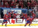  ?? Dave Sandford/NHLI/ Getty Images ?? Montreal Canadiens players jump over the boards after Josh Anderson’s gamewinnin­g goal in overtime on Monday night Photograph: