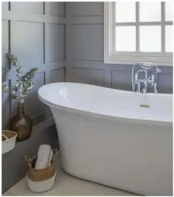  ??  ?? Panelling in moisture-resistant MDF and a free-standing tub give the bathroom a opulent look for less. ‘It’s like
I’ve stepped into a luxury hotel every time, and feels even better knowing we did it on a tight budget,’ reveals Vicky