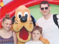  ??  ?? Park life: Stuart with kids Holly and Glenn at Walt Disney World and (right) Stuart working at Citybeat in the 1990s