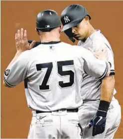  ?? AP ?? Clean-shaven Rougned Odor pulls into first base after RBI single in 10th inning of Yankees’ victory over Rays Sunday in St. Petersburg.