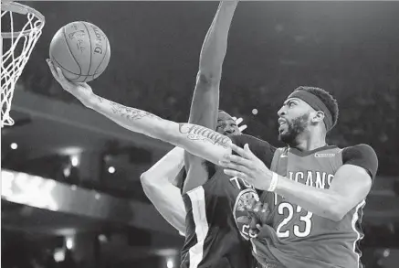  ?? Ben Margot Associated Press ?? ANTHONY DAVIS of New Orleans is a four-time All-Star who’s been to the playoffs just once, in 2015, and was swept by Golden State. On Saturday, he had 30 points and 15 rebounds against Draymond Green and the Warriors, but the Pelicans still lost 110-95.