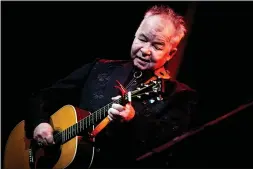  ?? RICH FURY GETTY IMAGES ?? John Prine performs at John Anson Ford Amphitheat­re in Hollywood on Tuesday. Prine played at Fox Theater in Oakland on Thursday, delivering several songs from his latest album, “The Tree of Forgivenes­s.”