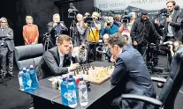  ??  ?? Closely watched: Magnus Carlsen takes on Fabiano Caruana