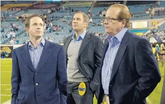  ?? Phelan M. Ebenhack Associated Press ?? CHARGERS CHAIRMAN Dean Spanos, right, watches a 2011 game in Jacksonvil­le, with his sons John, left, the team’s president of football operations, and A.G., president of business operations.