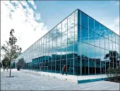  ?? JENS MEYER/AP ?? Clouds reflect in the facade of the new Bauhaus Museum in Dessau, Germany. The museum opened in September.