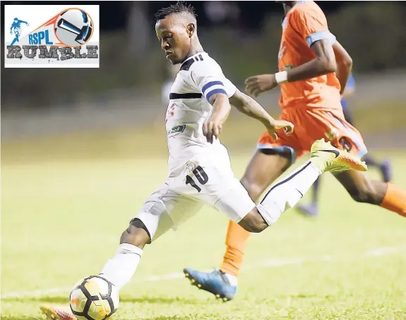  ??  ?? Cavalier SC’s Chevone ‘Messi’ Marsh taking a shot at goal during a recent Red Stripe Premier match against Sandals South Coast at the Stadium East field.