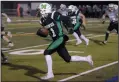  ?? NEWS PHOTO RYAN MCCRACKEN ?? Hat High Mohawks back Braeden Long runs during a Sept. 14 exhibition game against the Holy Trinity Knights at the Methanex Bowl.