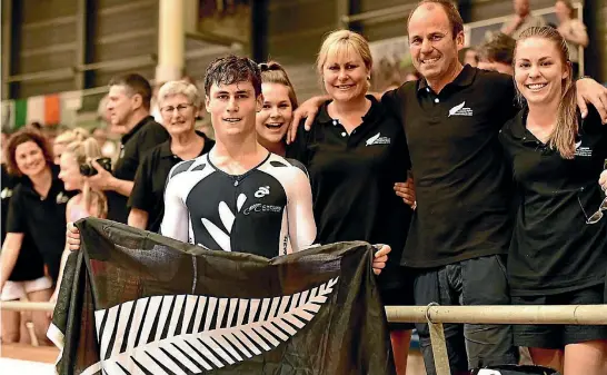  ?? PHOTO: GUY SWARBRICK ?? Manawatu cyclist Campbell Stewart celebrates with his family after defending his omnium title at the Junior Track Cycling World Championsh­ips in Switzerlan­d.