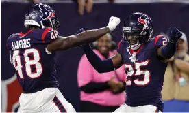  ?? Carmen Mandato/Getty Images ?? Christian Harris, left, of the Houston Texans celebrates with Desmond King II after scoring a touchdown off of an intercepti­on thrown by Joe Flacco during the third quarter of Saturday’s AFC wildcard game in Houston. Photograph: