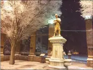  ?? MEDIANEWS GROUP FILE PHOTO ?? Snow falls on the shoulders of the Grand Army of the Republic statue that keeps quiet watch over High Street in downtown Pottstown.