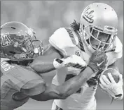  ?? Robert Gauthier Los Angeles Times ?? ARIZONA’S Will Parks appears to grab Paul Perkins’ facemask while the tackling the UCLA running back.