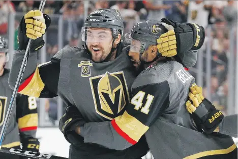  ?? JOHN LOCHER/THE ASSOCIATED PRESS ?? Vegas Golden Knights forwards William Carrier and Pierre-Edouard Bellemare celebrate after Bellemare scored against the Blackhawks last month. The Knights are in the mix in the Pacific Division and have the look of a team with legitimate playoff...