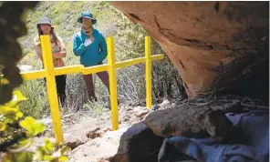  ?? ANA RAMIREZ U-T FILE ?? Armida Gomez (left) and Jasmin Garcia pay their respects to three sisters who died in February 2020 in San Diego County. Efforts to save lives have increased since the three died.