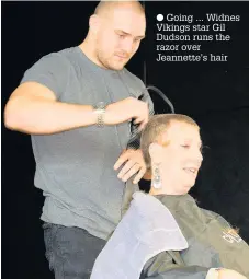  ??  ?? Going ... Widnes Vikings star Gil Dudson runs the razor over Jeannette’s hair