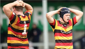  ??  ?? Sligo players can’t hide their disappoint­ment at the final whistle.