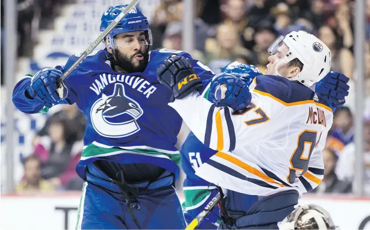  ?? — CANADIAN PRESS FILES ?? Darren Archibald got in some pre-season licks for the Canucks in September, jolting Edmonton Oilers superstar Connor McDavid with a check at Rogers Arena.